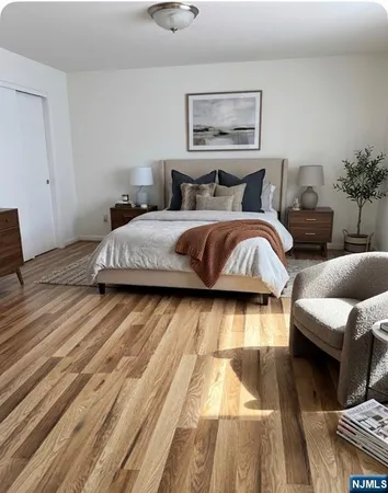 a bedroom with bed and a couch
