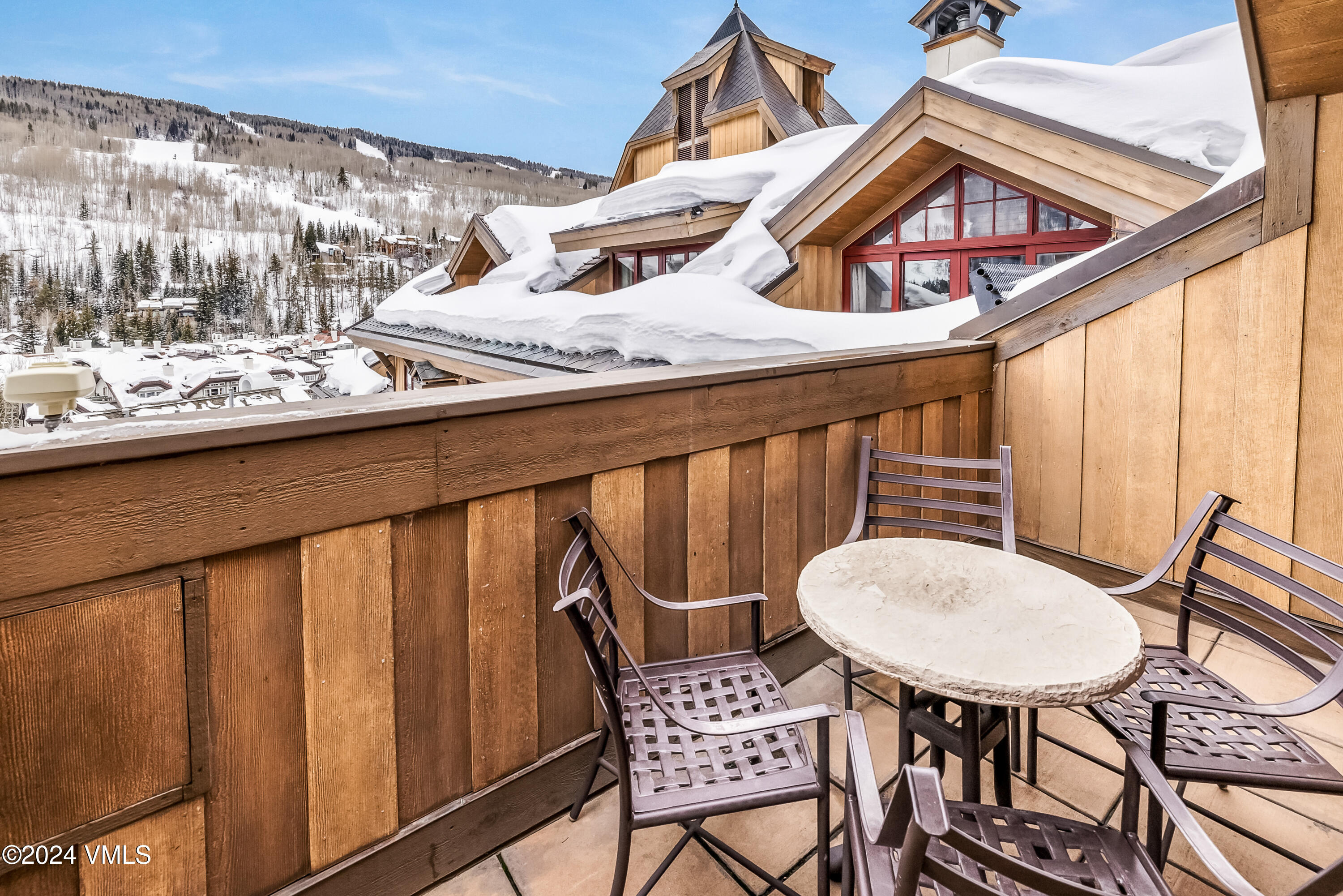 16 Vail Road Vail, CO 81657 - Photo 11 of 36 a view of a chairs and table in the balcony
