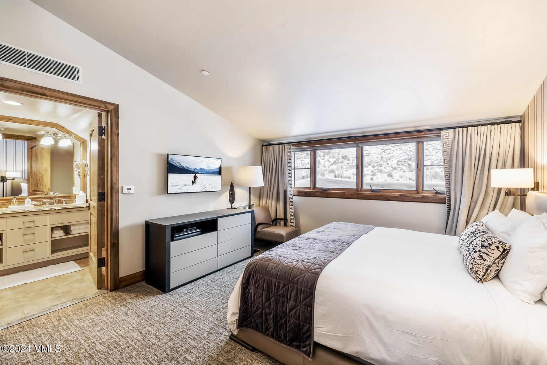 16 Vail Road Vail, CO 81657 - Photo 13 of 36 a bedroom with a large bed and a view of bedroom