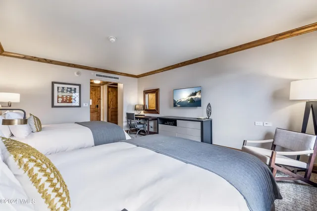 a balcony view with couple of chairs