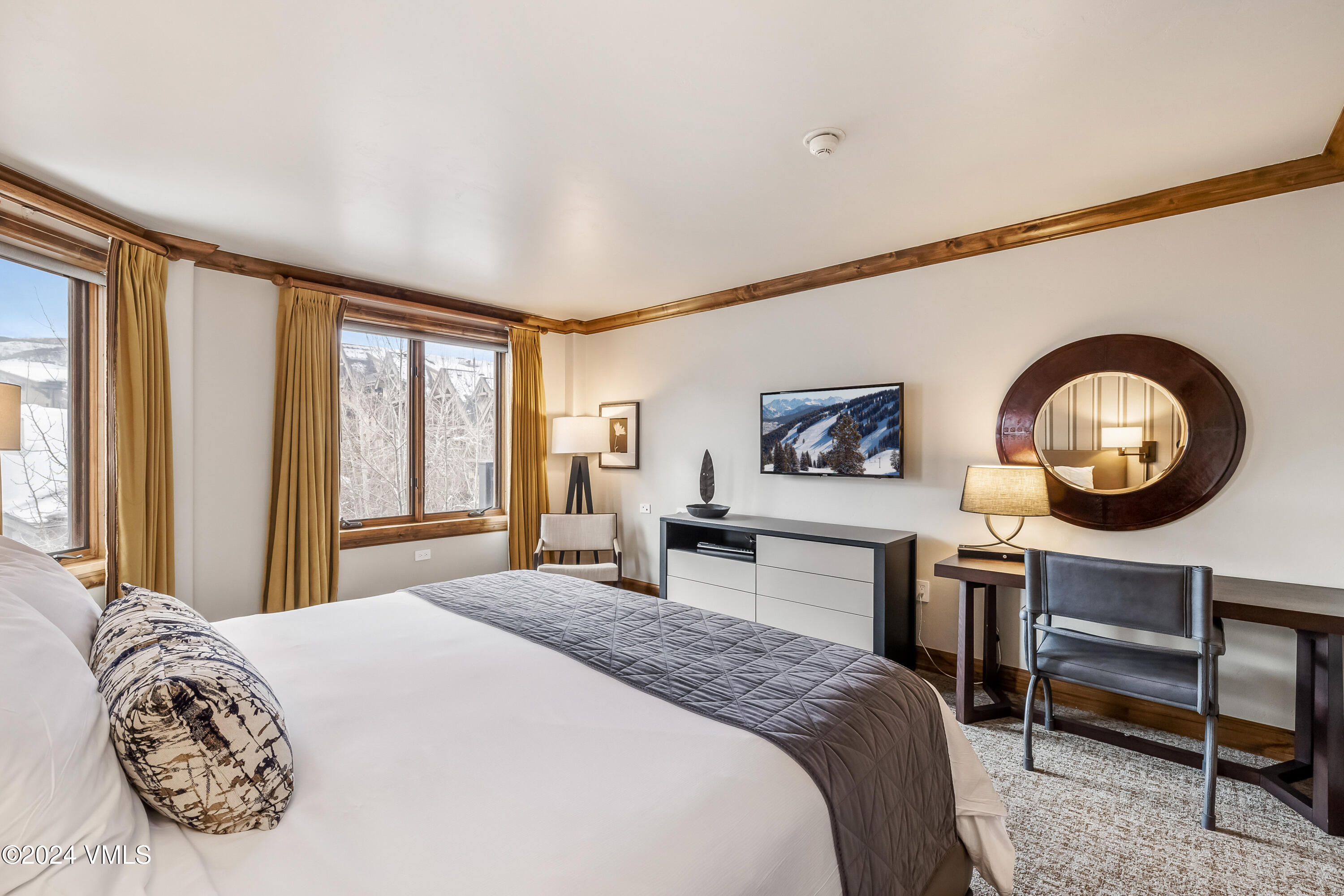 16 Vail Road Vail, CO 81657 - Photo 22 of 36 a bedroom with a large bed and a large window