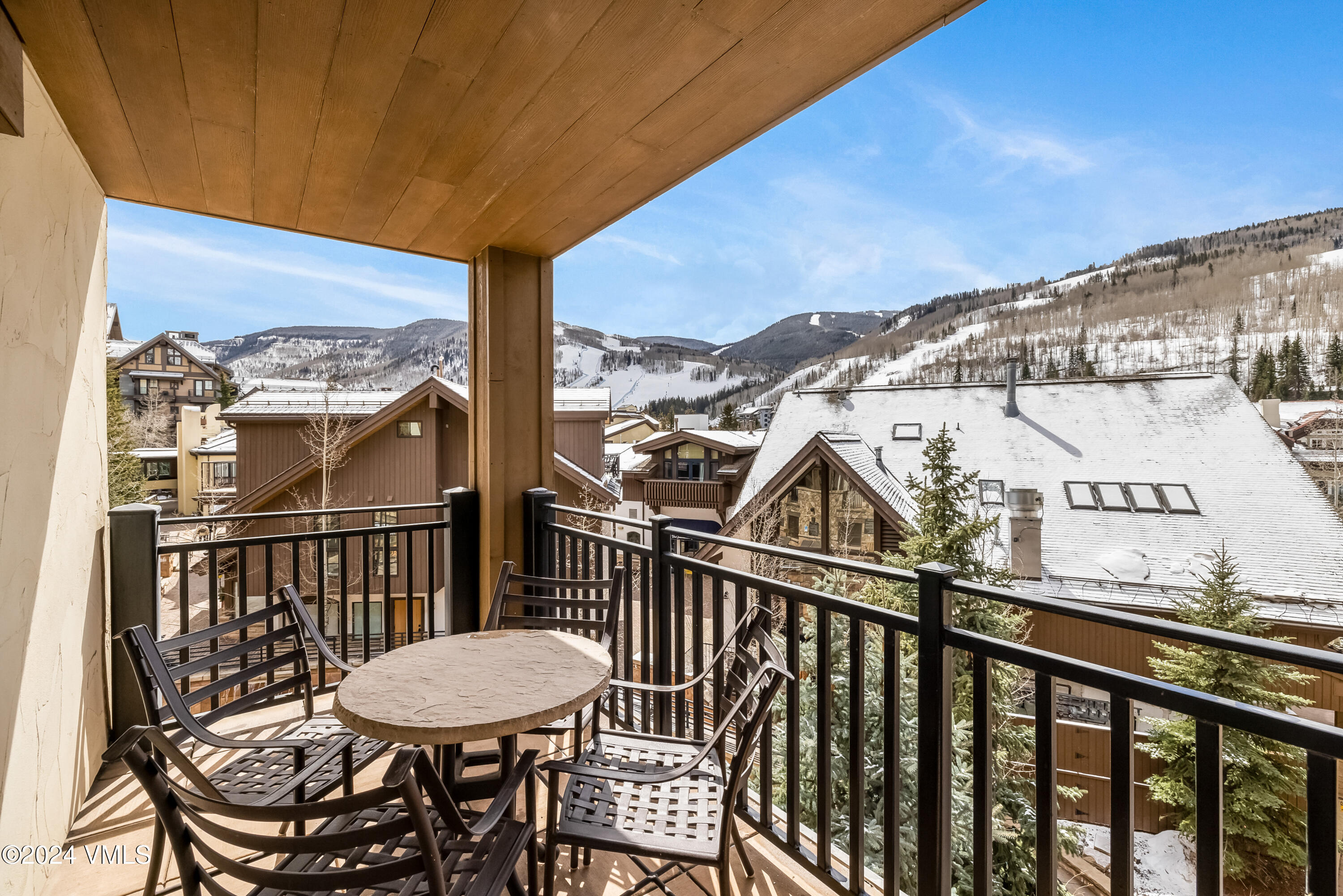 16 Vail Road Vail, CO 81657 - Photo 25 of 36 a view of a balcony with a table and chairs