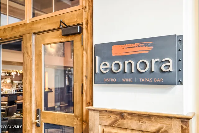 a view of a play room with furniture and wooden floor