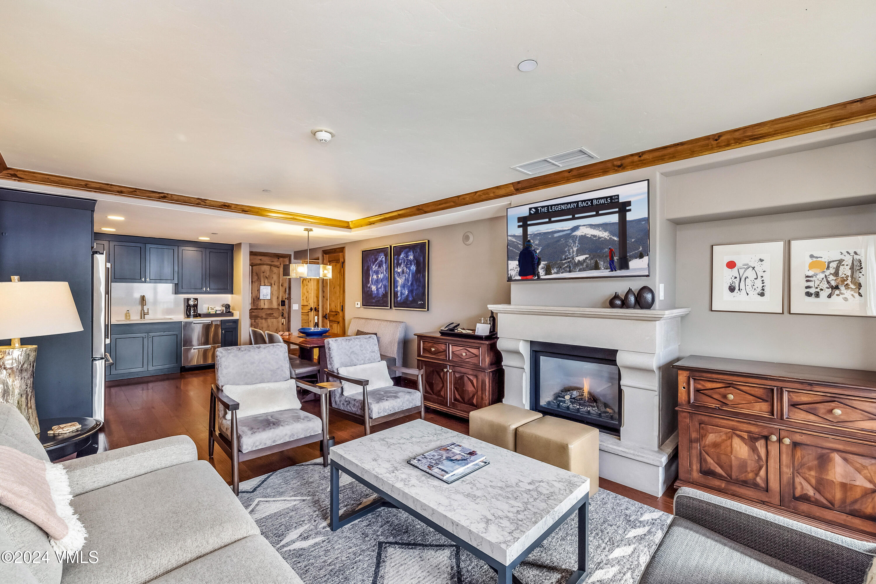 16 Vail Road Vail, CO 81657 - Photo 8 of 36 a living room with furniture and a fireplace
