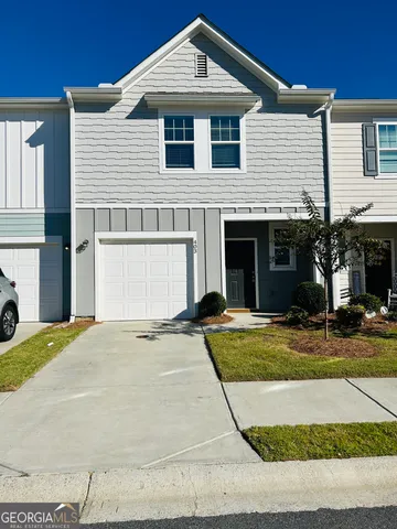 a front view of a house with yard