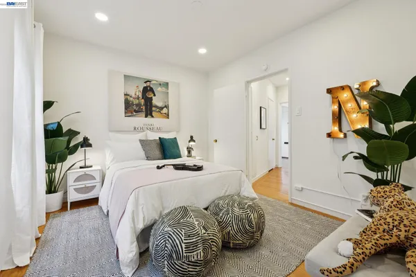 a bedroom with a bed and a couch