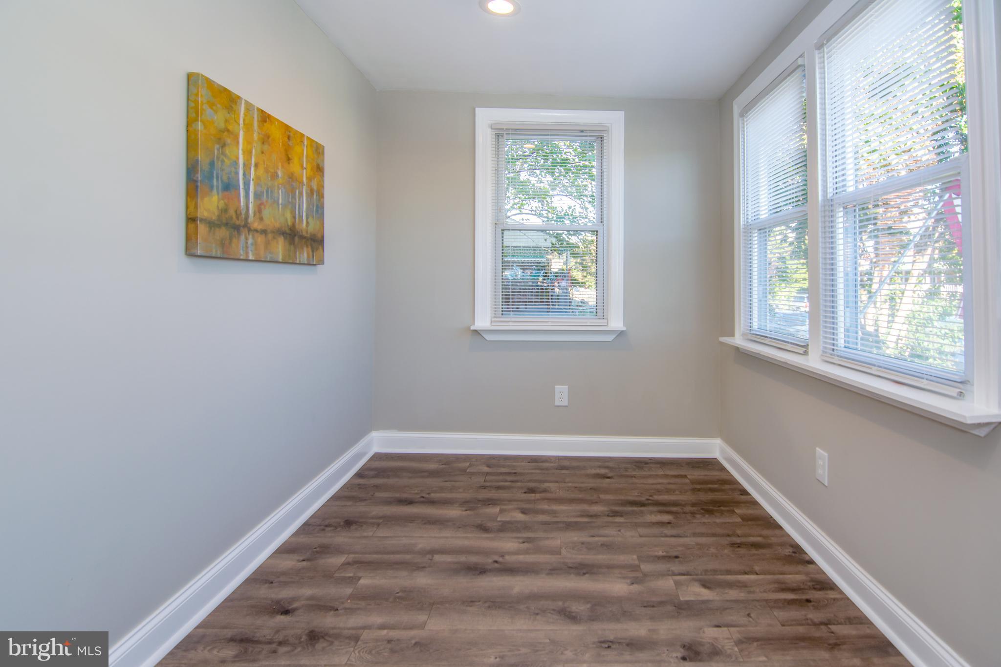 2056 Jasmine Road Dundalk, MD 21222 - Photo 11 of 30 a view of an empty room with wooden floor and a window