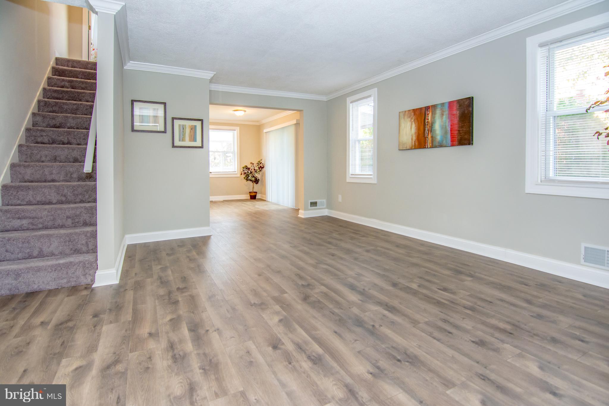 2056 Jasmine Road Dundalk, MD 21222 - Photo 12 of 30 a view of an empty room with wooden floor and a window