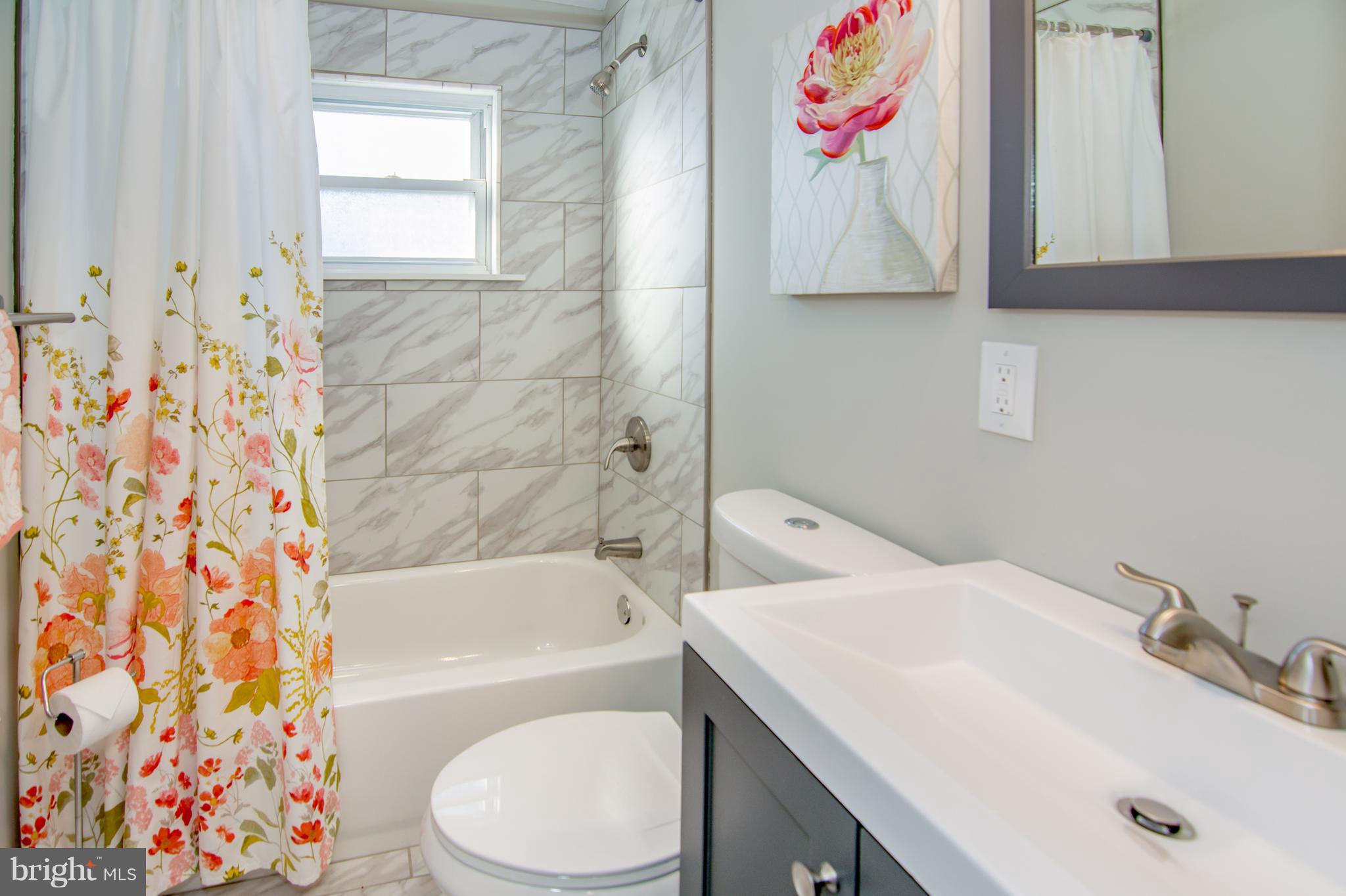 2056 Jasmine Road Dundalk, MD 21222 - Photo 23 of 30 a bathroom with a sink toilet and bathtub