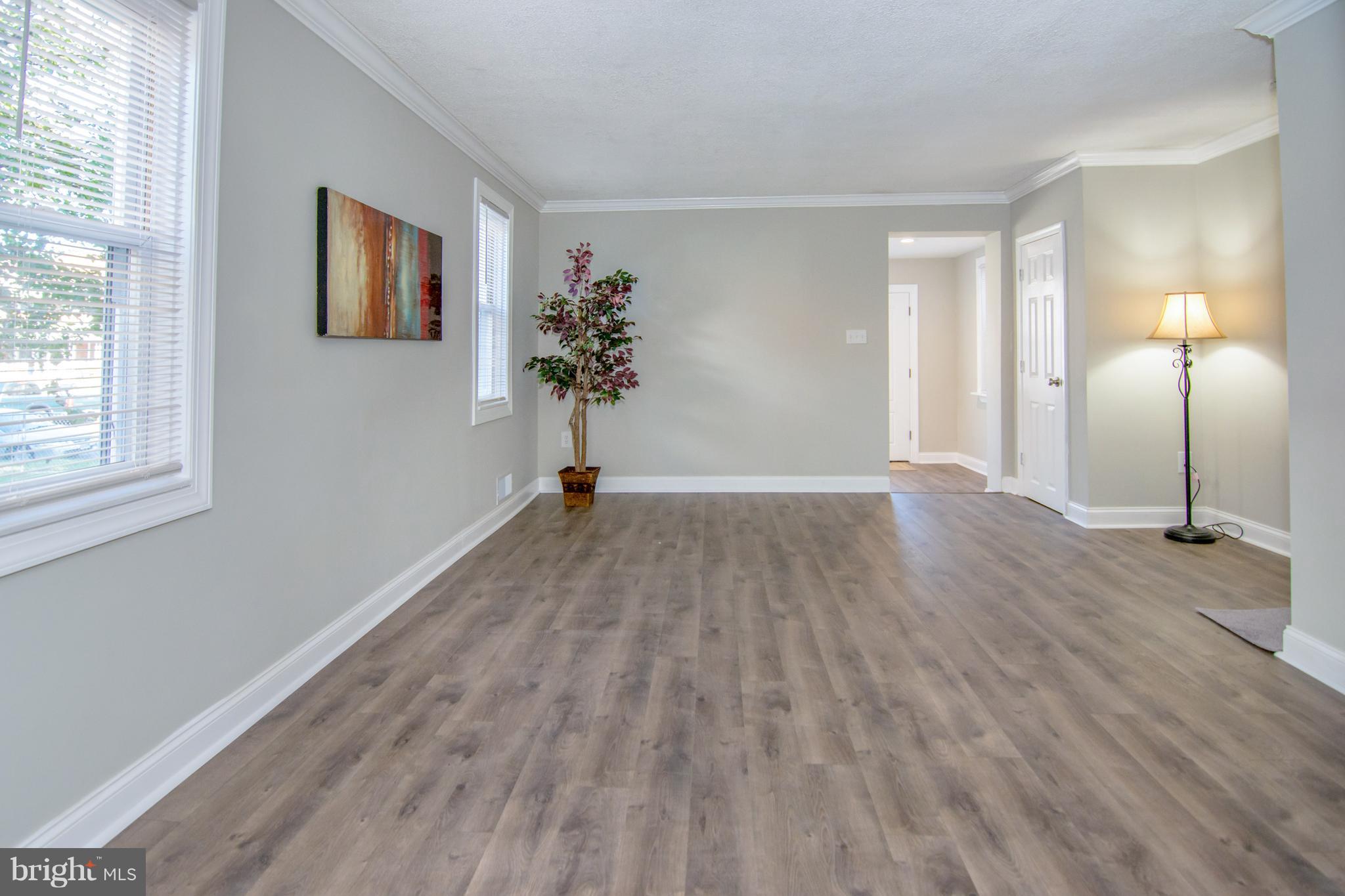 2056 Jasmine Road Dundalk, MD 21222 - Photo 5 of 30 a view of a room with wooden floor and window