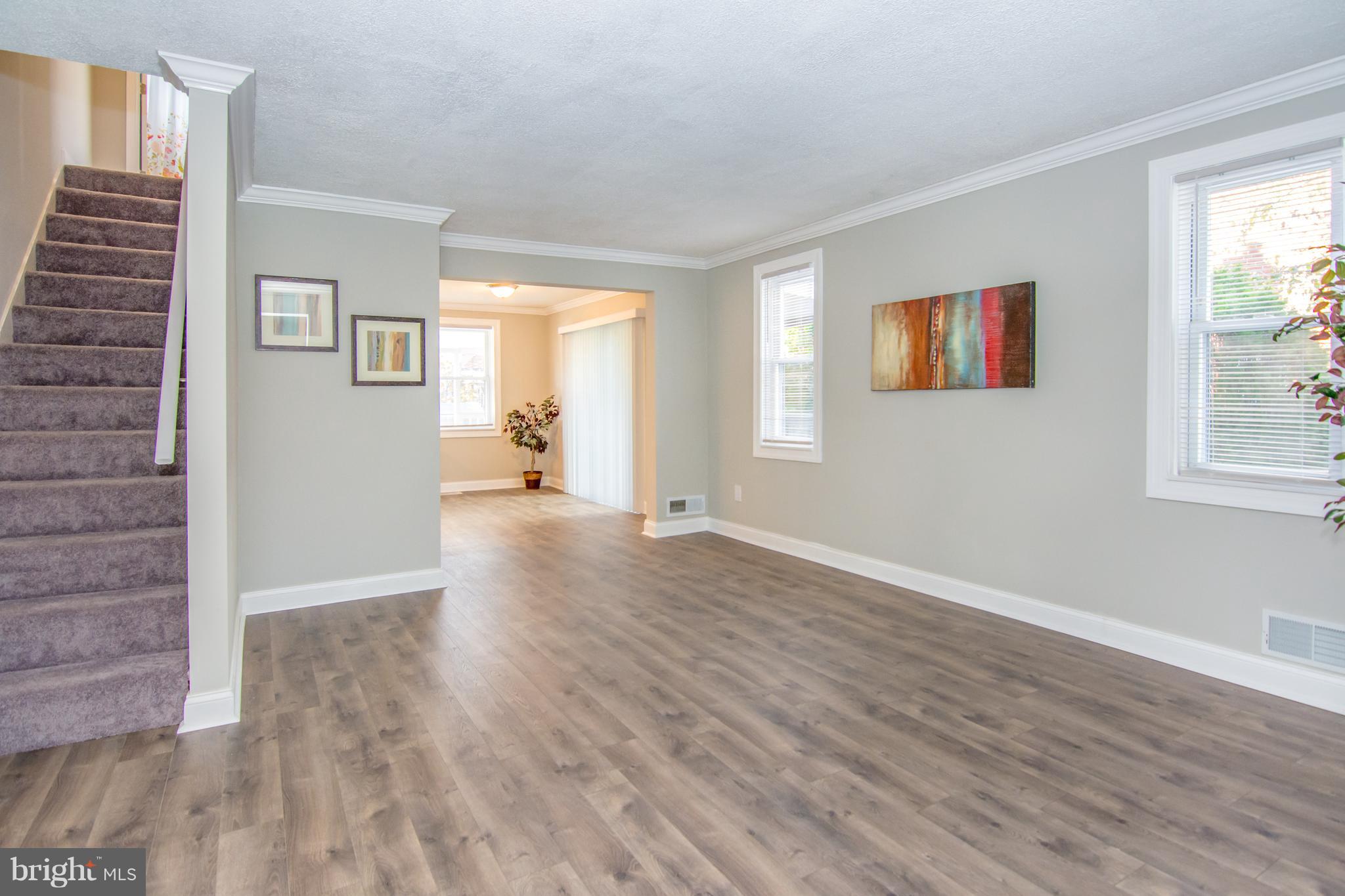 2056 Jasmine Road Dundalk, MD 21222 - Photo 8 of 30 an empty room with wooden floor and windows