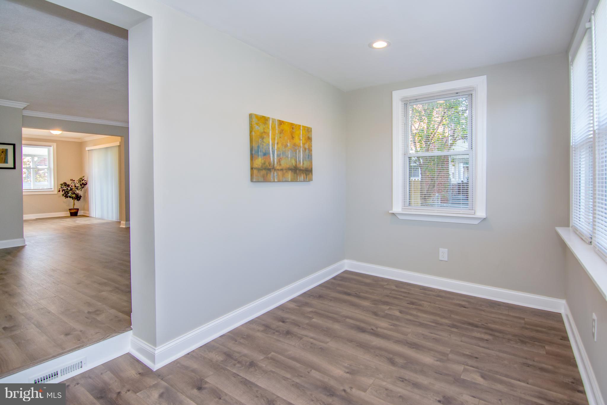 2056 Jasmine Road Dundalk, MD 21222 - Photo 10 of 30 a view of a big room with wooden floor and windows