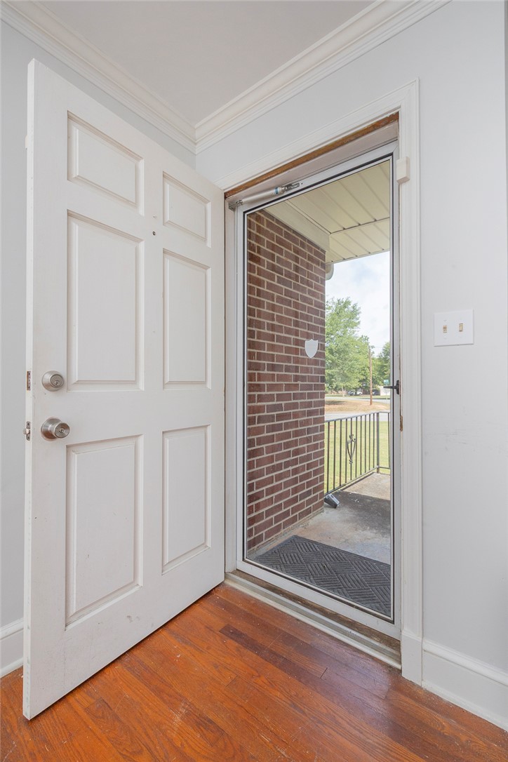 1218 Bolt Drive Anderson, SC 29621 - Photo 7 of 46 A welcoming entry, with a glass storm door revealing the charming brick exterior.