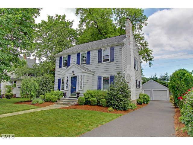 54 Ludlowe Road Fairfield, CT 06824 - Photo 1 of 1 a front view of a house with a yard