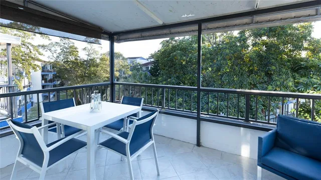 a view of a patio with a table chairs and a table