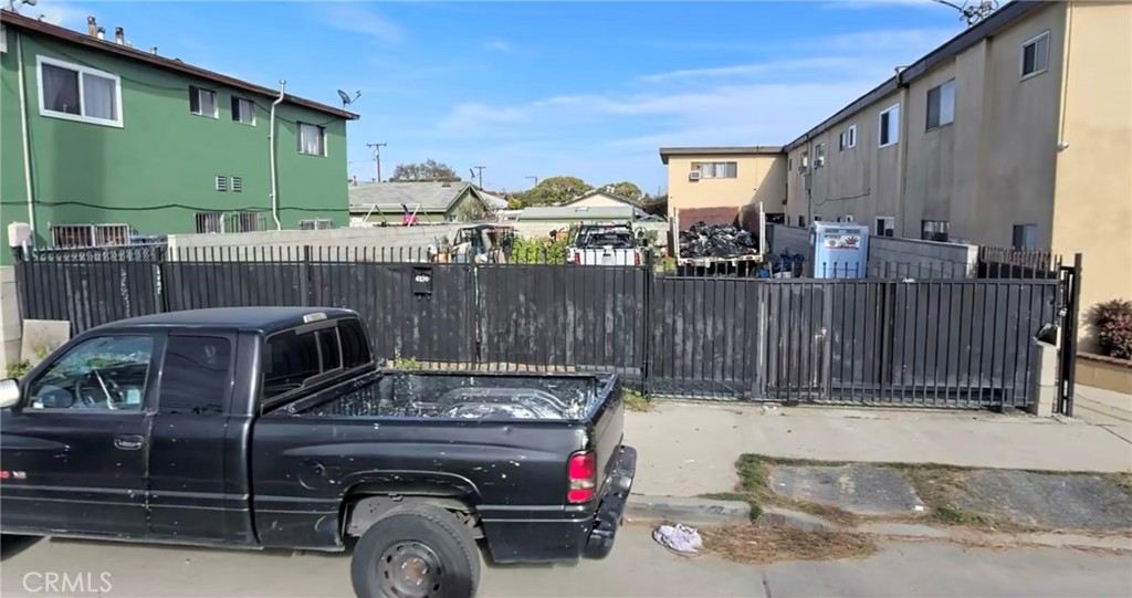 a view of a car park in front of house