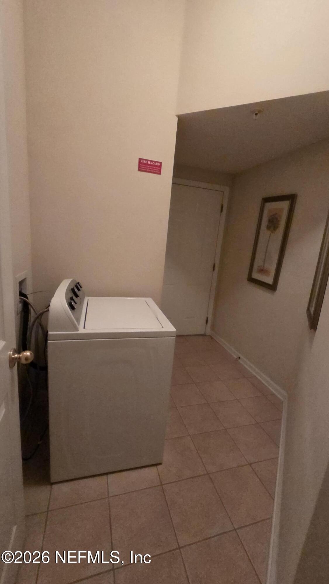 9400 Underwing Way, Unit 9 Jacksonville, FL 32257 - Photo 13 of 30 a utility room with dryer and washer