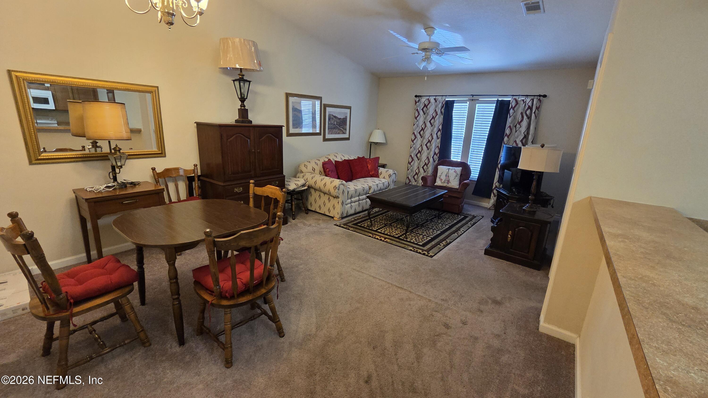 9400 Underwing Way, Unit 9 Jacksonville, FL 32257 - Photo 21 of 30 a living room with furniture and a flat screen tv
