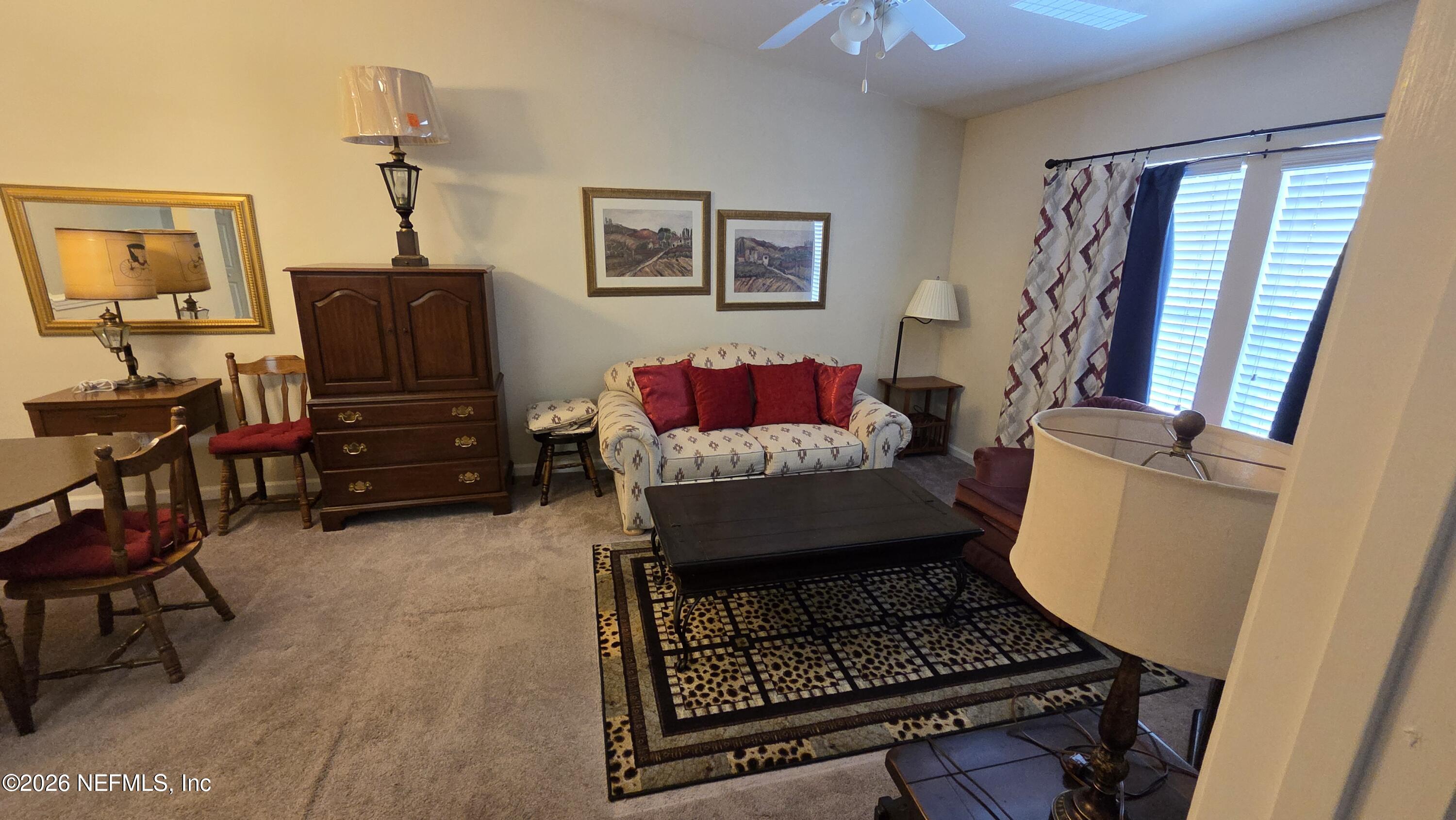 9400 Underwing Way, Unit 9 Jacksonville, FL 32257 - Photo 22 of 30 a living room with furniture and a window