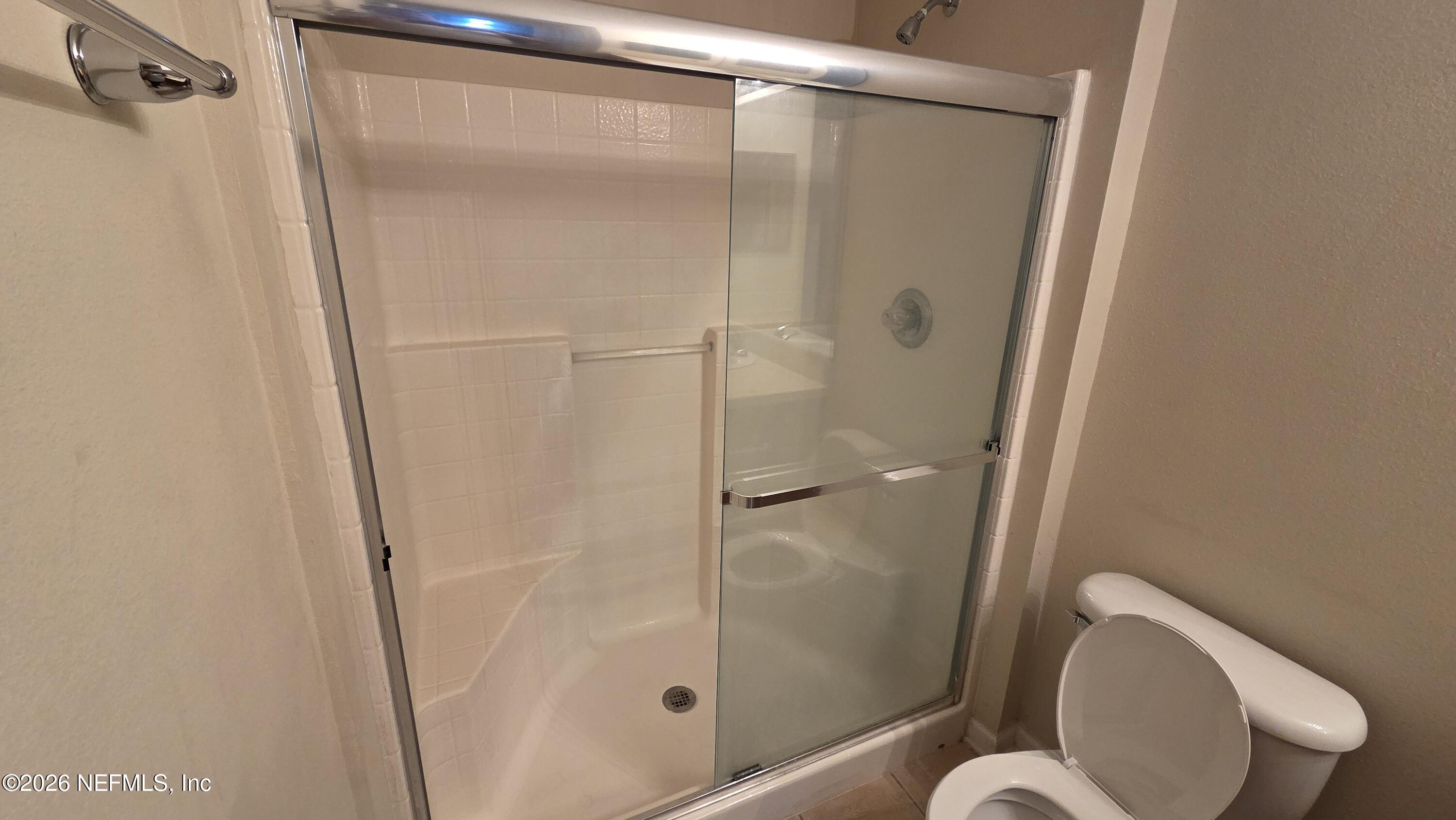 9400 Underwing Way, Unit 9 Jacksonville, FL 32257 - Photo 24 of 30 a bathroom with a shower and toilet