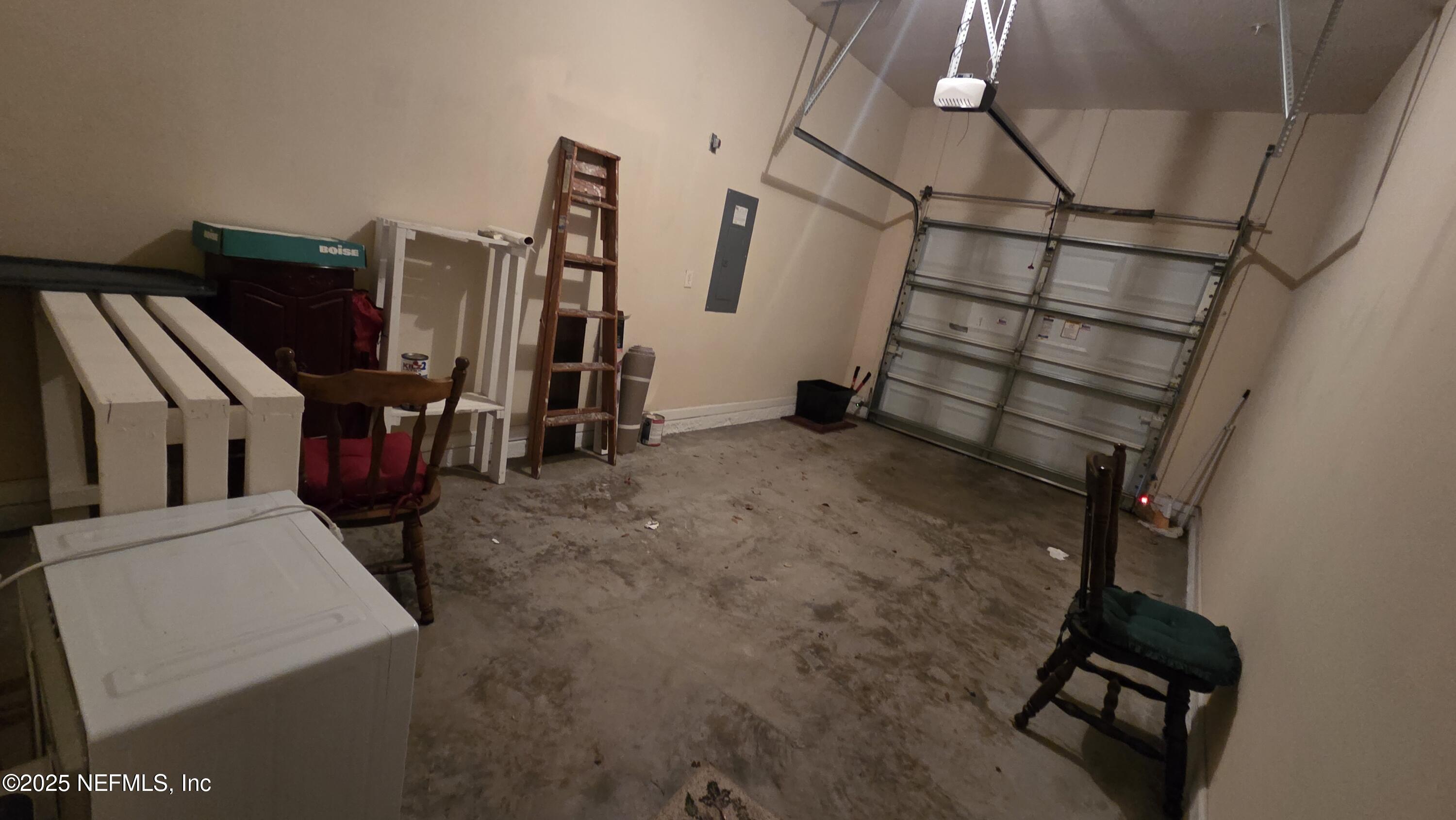 9400 Underwing Way, Unit 9 Jacksonville, FL 32257 - Photo 3 of 30 a view of an empty room with wooden floor and windows