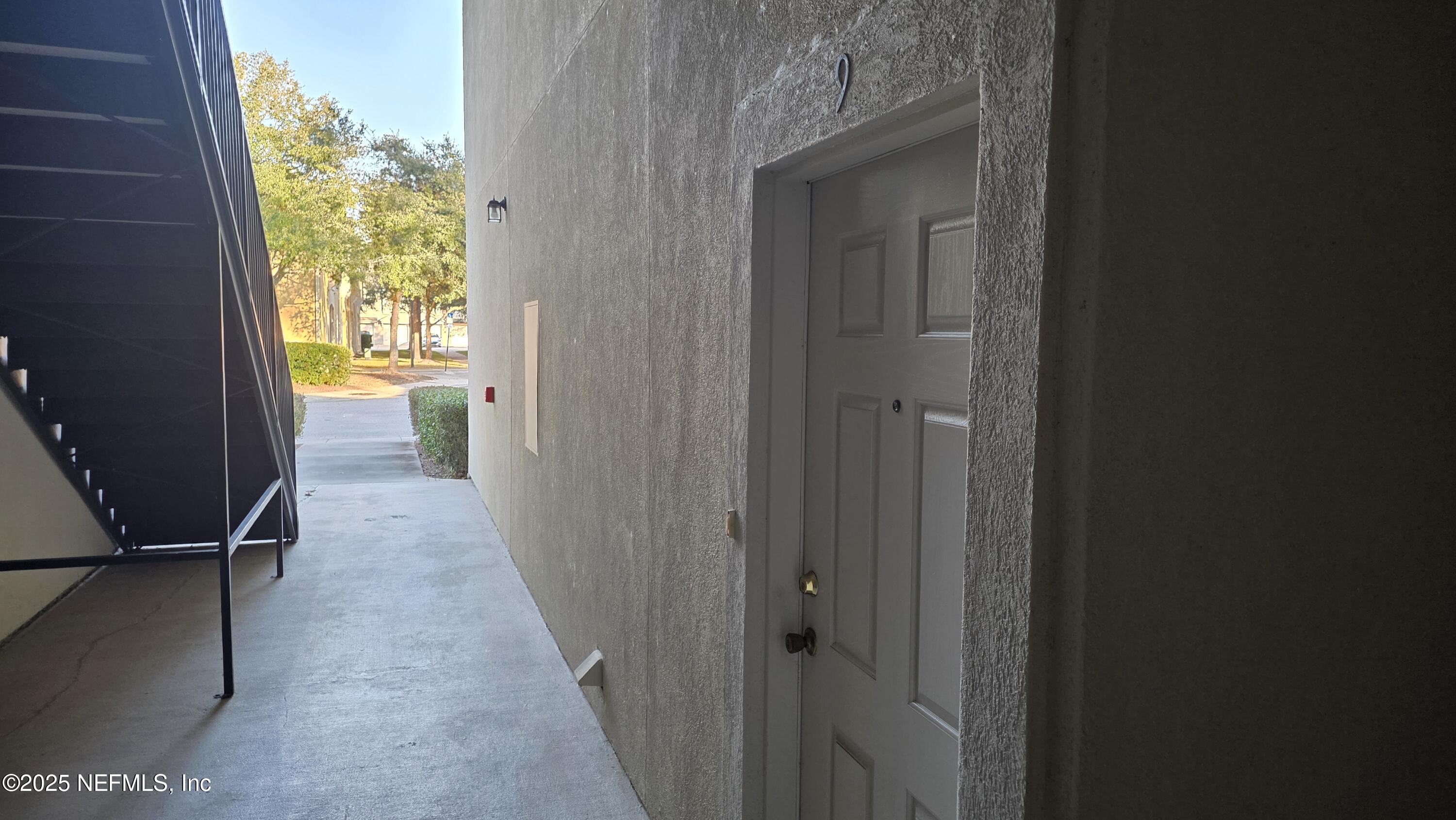9400 Underwing Way, Unit 9 Jacksonville, FL 32257 - Photo 8 of 30 a view of a hallway with wooden floor and a window