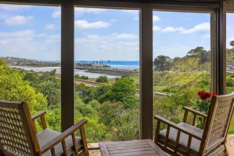 a view of a wooden deck with a back yard