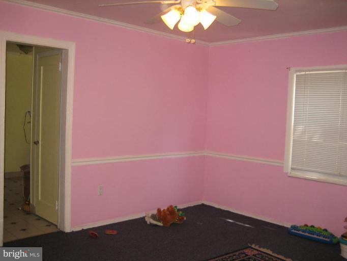 11705 Idlewood Road Silver Spring, MD 20906 - Photo 3 of 10 an empty room with a window