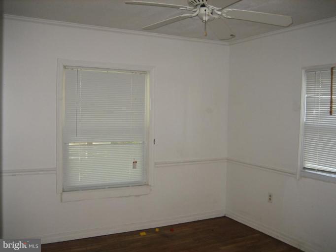 11705 Idlewood Road Silver Spring, MD 20906 - Photo 5 of 10 an empty room with a window and closet