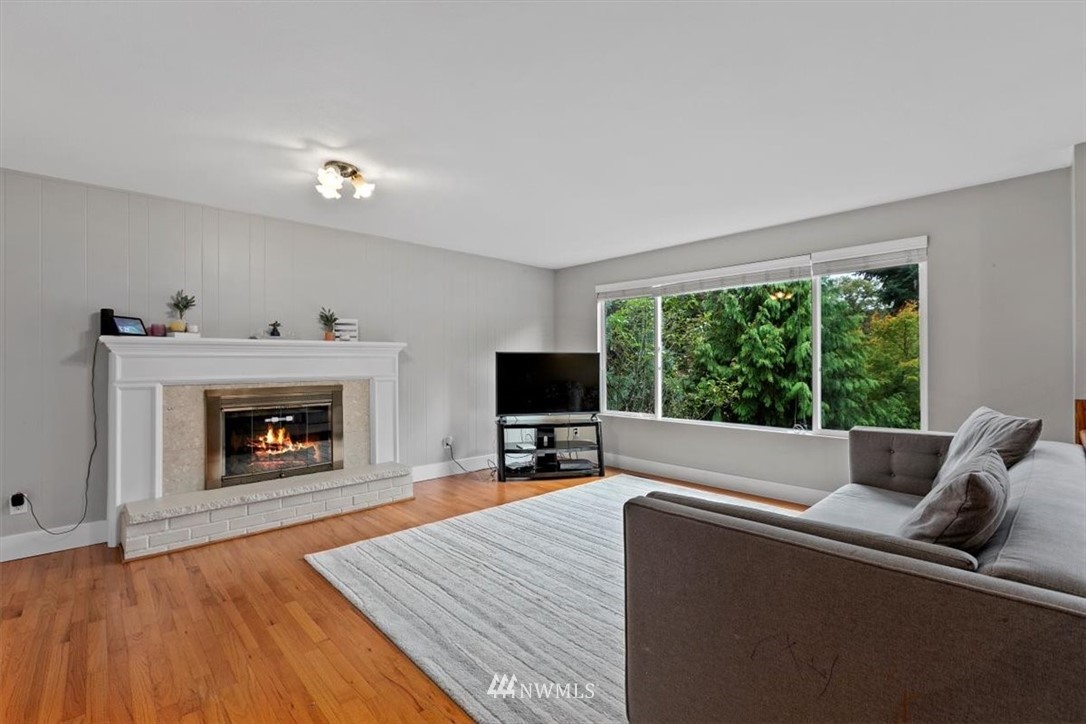12656 177th Place Southeast Renton, WA 98059 - Photo 2 of 27 a living room with furniture and a fireplace