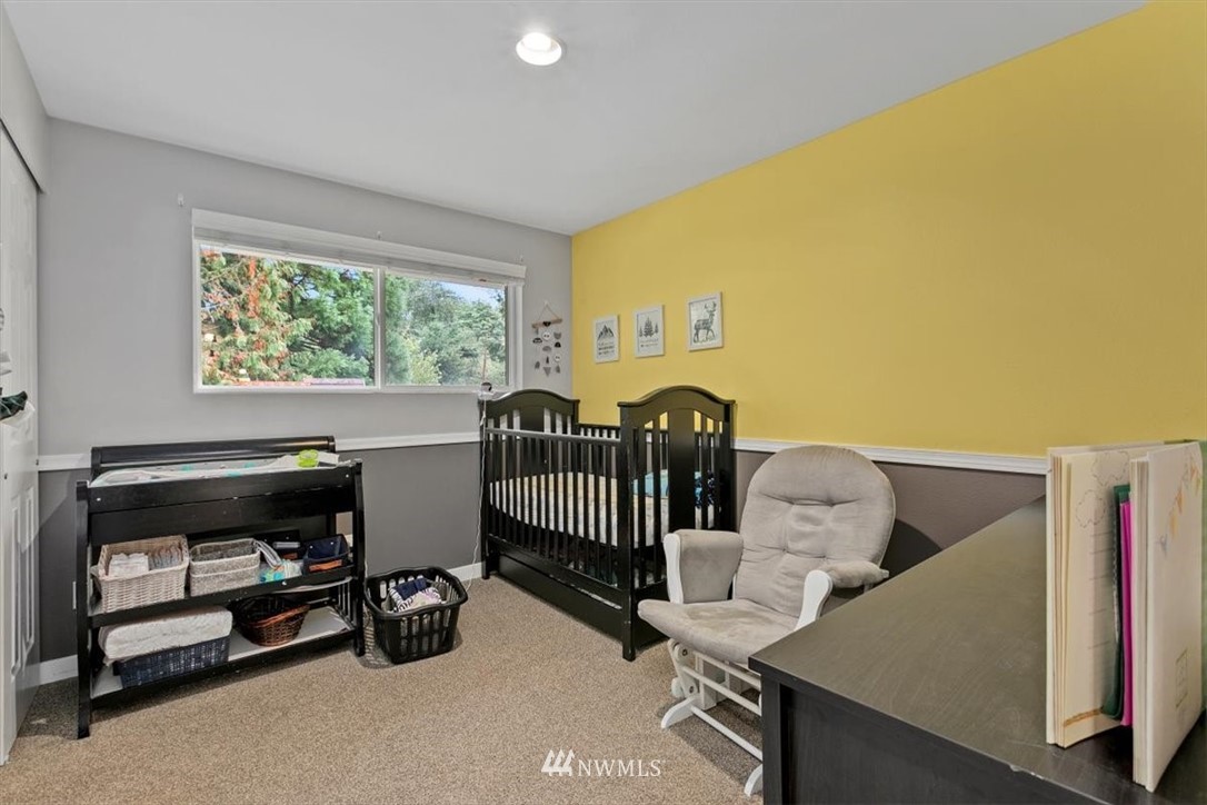 12656 177th Place Southeast Renton, WA 98059 - Photo 11 of 27 a bedroom with furniture and a window