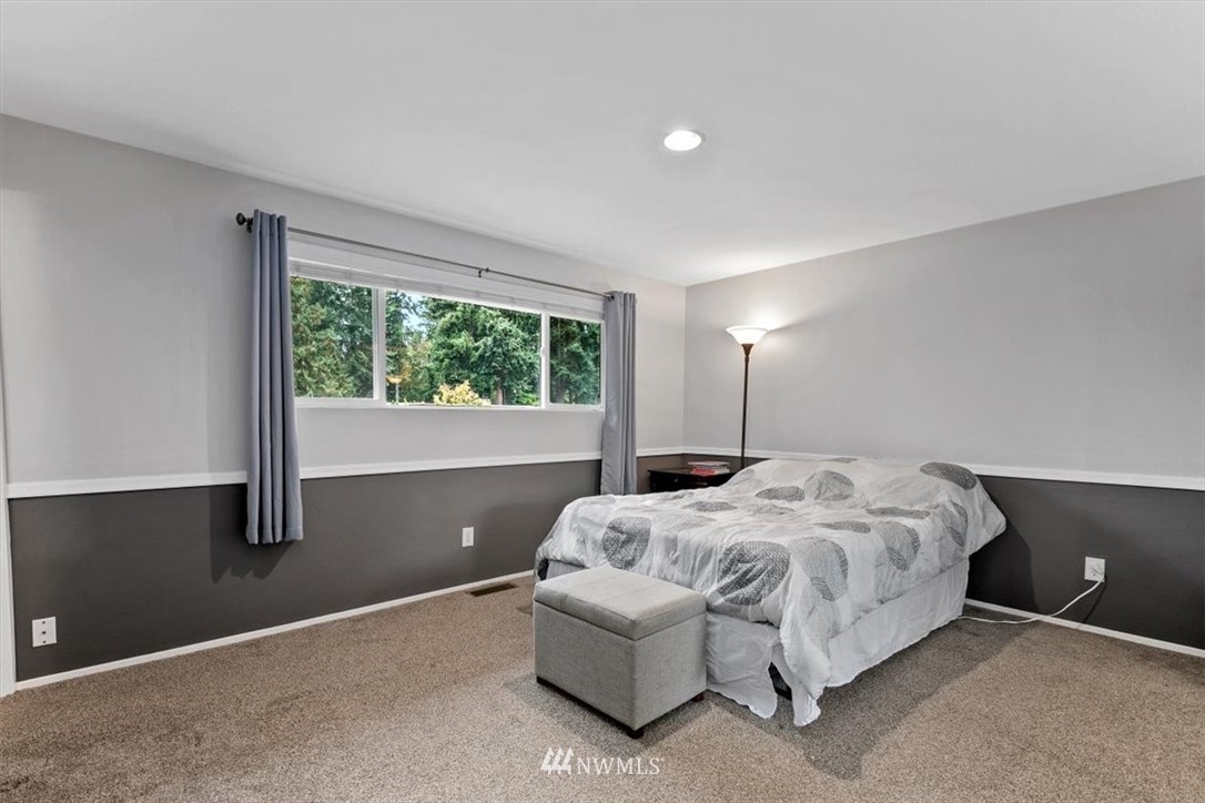 12656 177th Place Southeast Renton, WA 98059 - Photo 12 of 27 a bedroom with bed and window