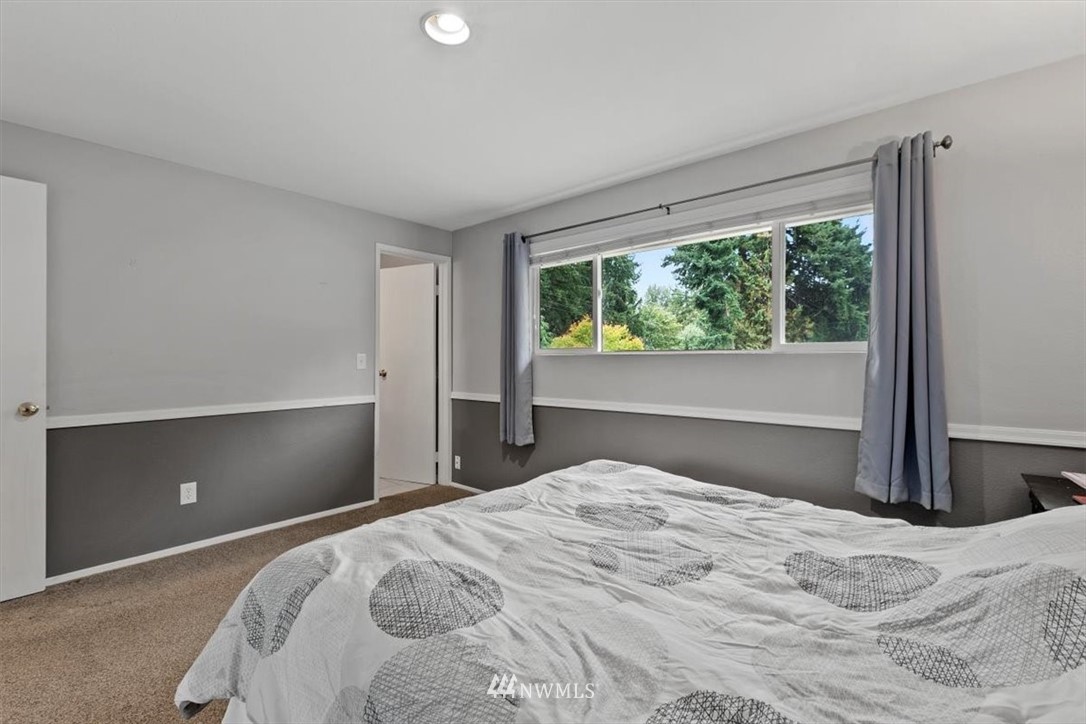 12656 177th Place Southeast Renton, WA 98059 - Photo 14 of 27 a bedroom with a bed and window