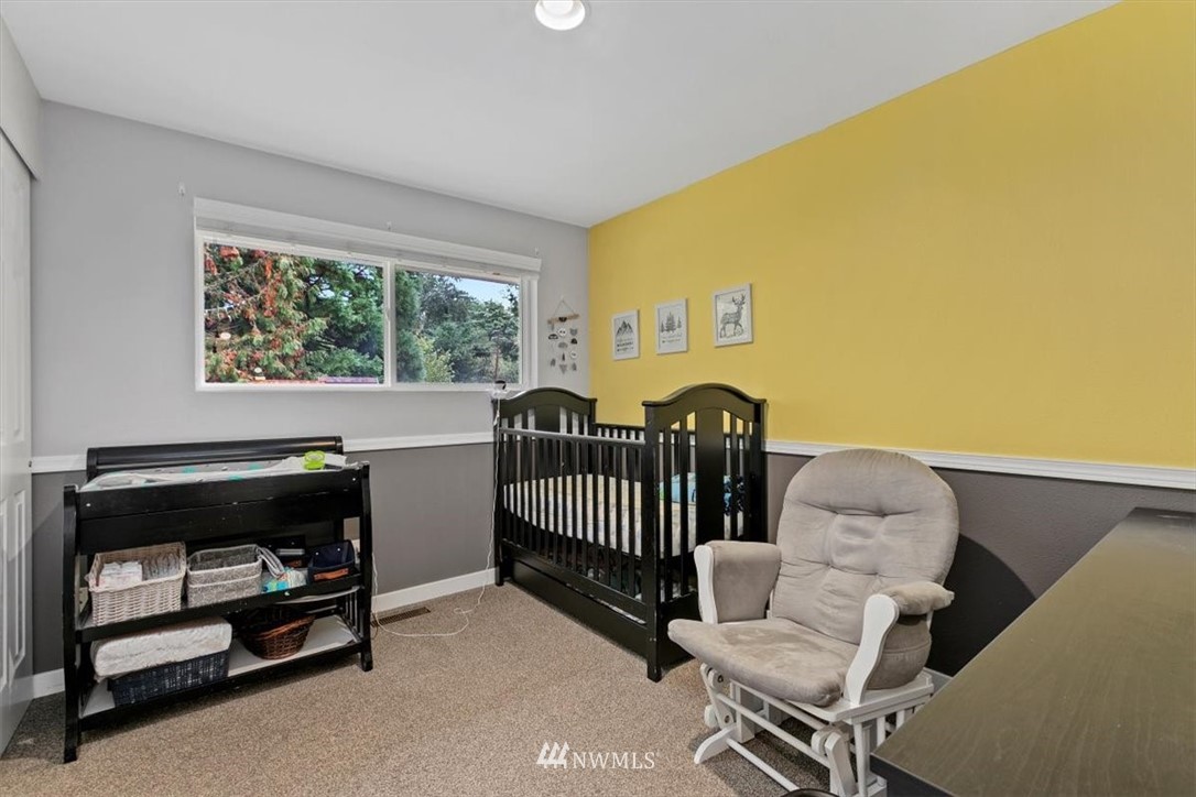 12656 177th Place Southeast Renton, WA 98059 - Photo 16 of 27 a bedroom with a bed and a window