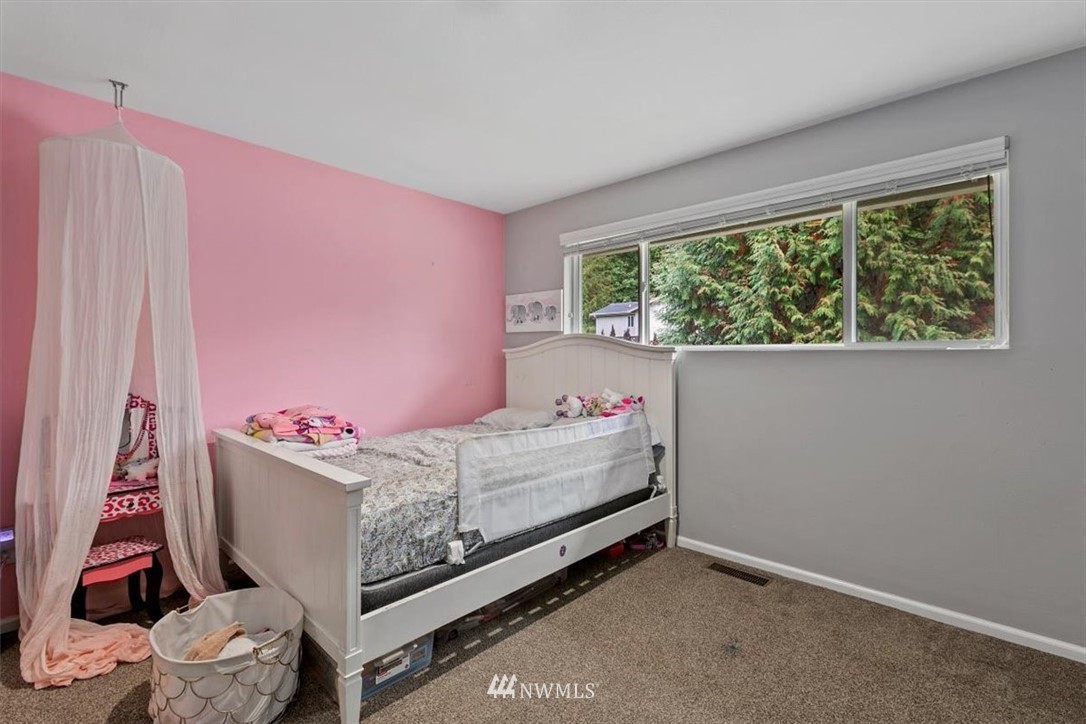 12656 177th Place Southeast Renton, WA 98059 - Photo 17 of 27 a bed room with a bed and a window