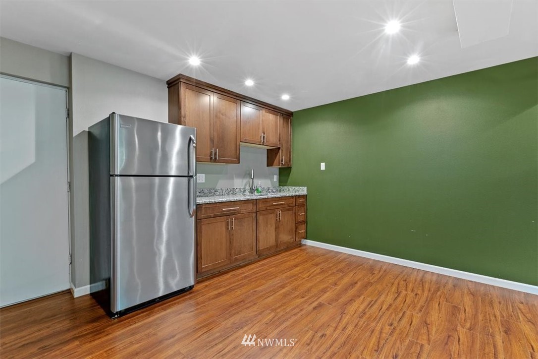12656 177th Place Southeast Renton, WA 98059 - Photo 19 of 27 a kitchen with a refrigerator and a sink
