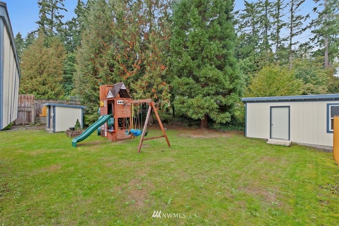 12656 177th Place Southeast Renton, WA 98059 - Photo 24 of 27 a view of a house with a backyard and a slide
