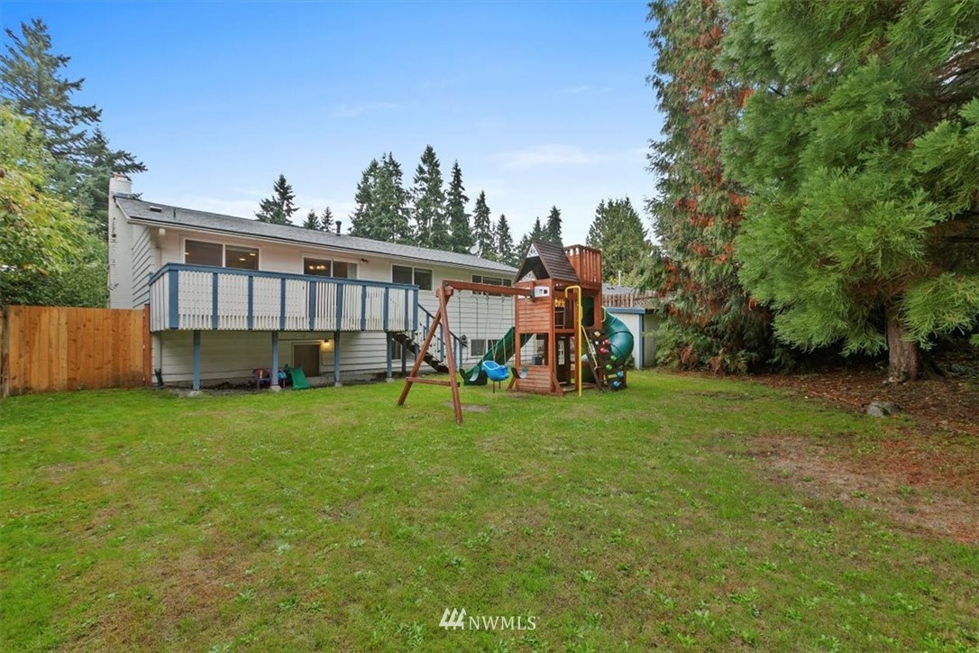12656 177th Place Southeast Renton, WA 98059 - Photo 25 of 27 a view of a house with backyard and a tree