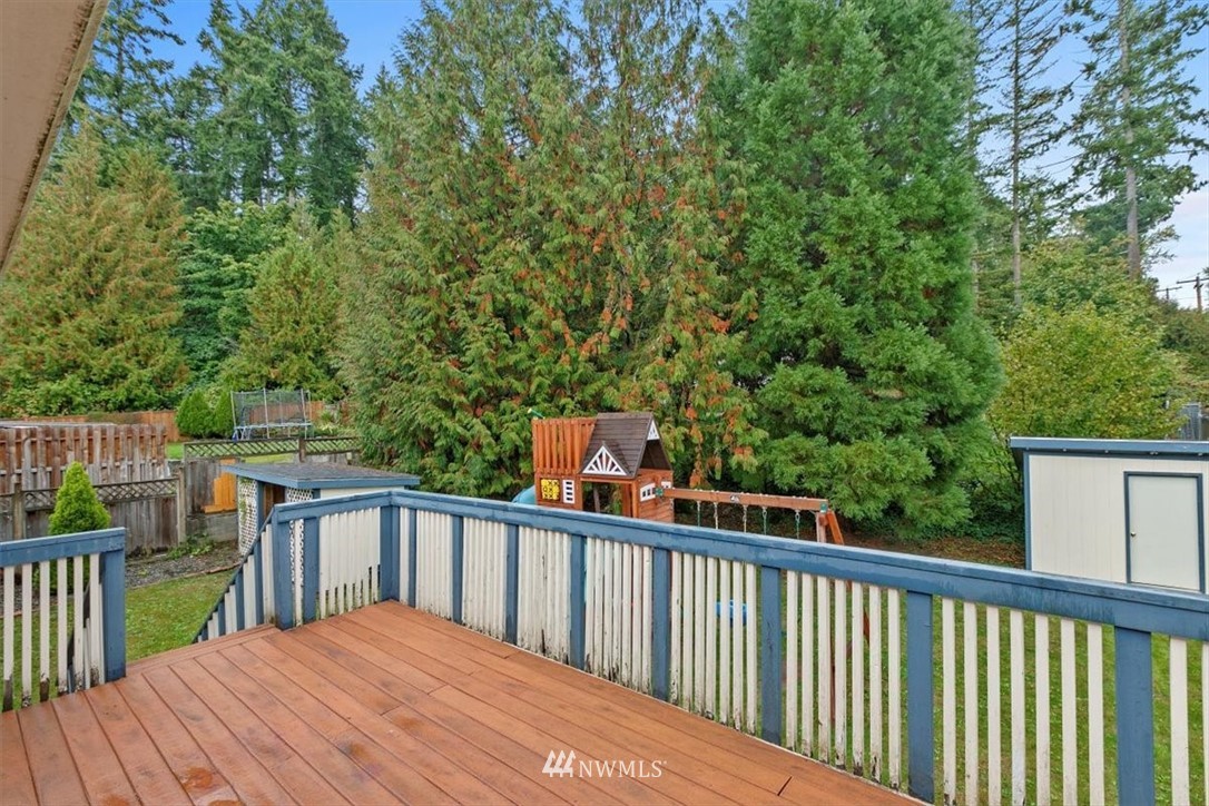 12656 177th Place Southeast Renton, WA 98059 - Photo 26 of 27 a balcony with wooden floor and fence