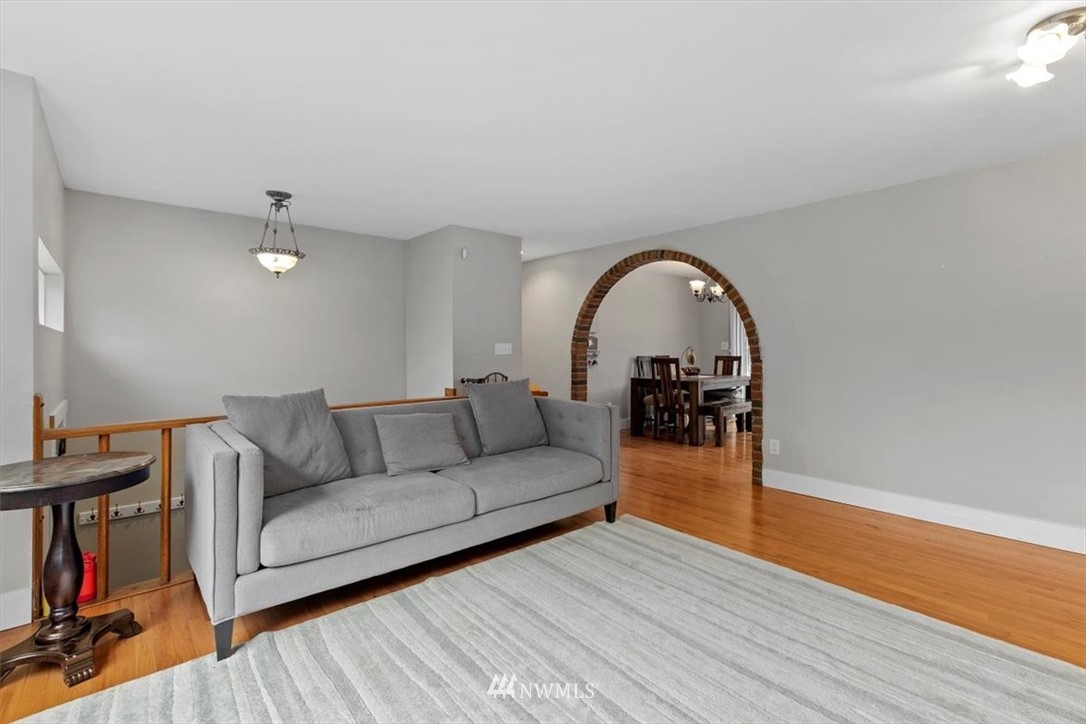 12656 177th Place Southeast Renton, WA 98059 - Photo 4 of 27 a living room with furniture and a wooden floor