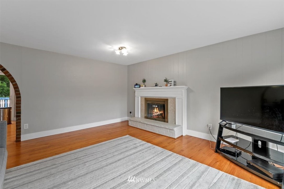 12656 177th Place Southeast Renton, WA 98059 - Photo 5 of 27 a living room with furniture and a flat screen tv
