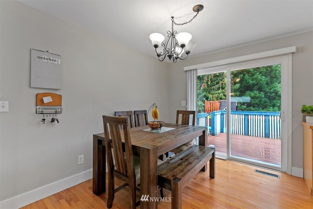12656 177th Place Southeast Renton, WA 98059 - Photo 6 of 27 a view of a dining room with furniture wooden floor and chandelier