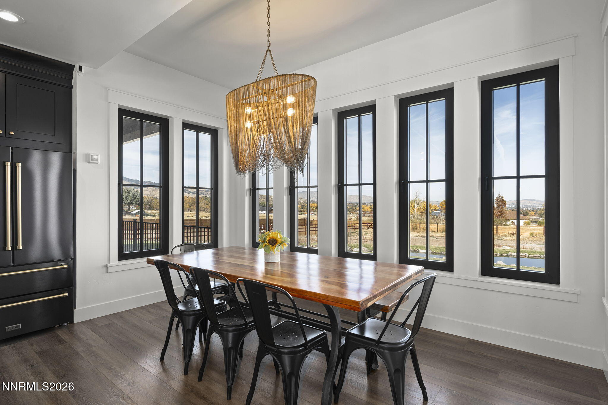 1426 Foothill Road Reno, NV 89511 - Photo 23 of 100 a view of a dining room with furniture window and wooden floor