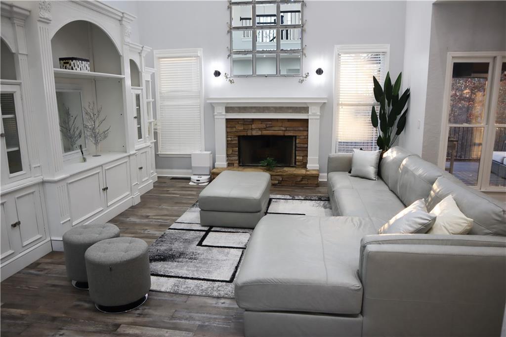 523 Waterside Court Canton, GA 30114 - Photo 14 of 28 a living room with furniture and a fireplace