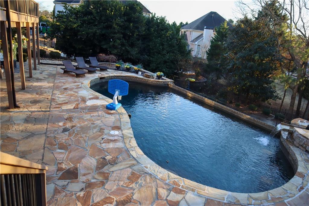 523 Waterside Court Canton, GA 30114 - Photo 4 of 28 a view of swimming pool from a lounge chair