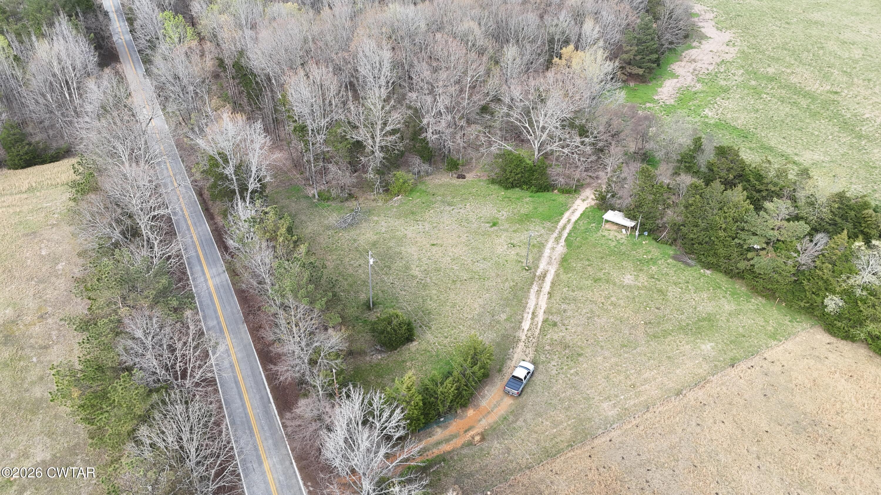 500 Hinkle Road Sardis, TN 38371 - Photo 4 of 11 a view of a yard with large trees