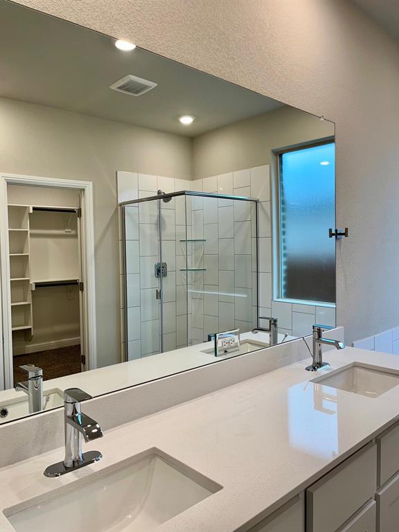 11505 Adare Drive Haslet, TX 76052 - Photo 13 of 17 a bathroom with double vanity sink and a mirror