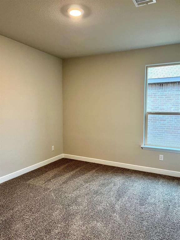 11505 Adare Drive Haslet, TX 76052 - Photo 7 of 17 an empty room with a window
