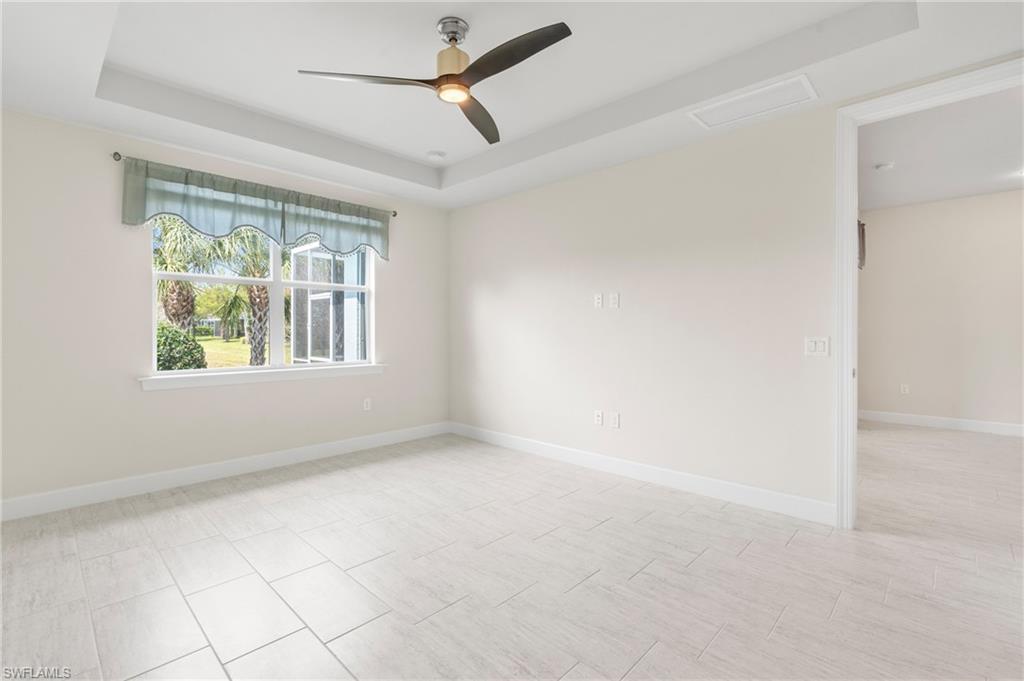 20128 Torch Key Way Estero, FL 33928 - Photo 12 of 50 an empty room with windows and fan