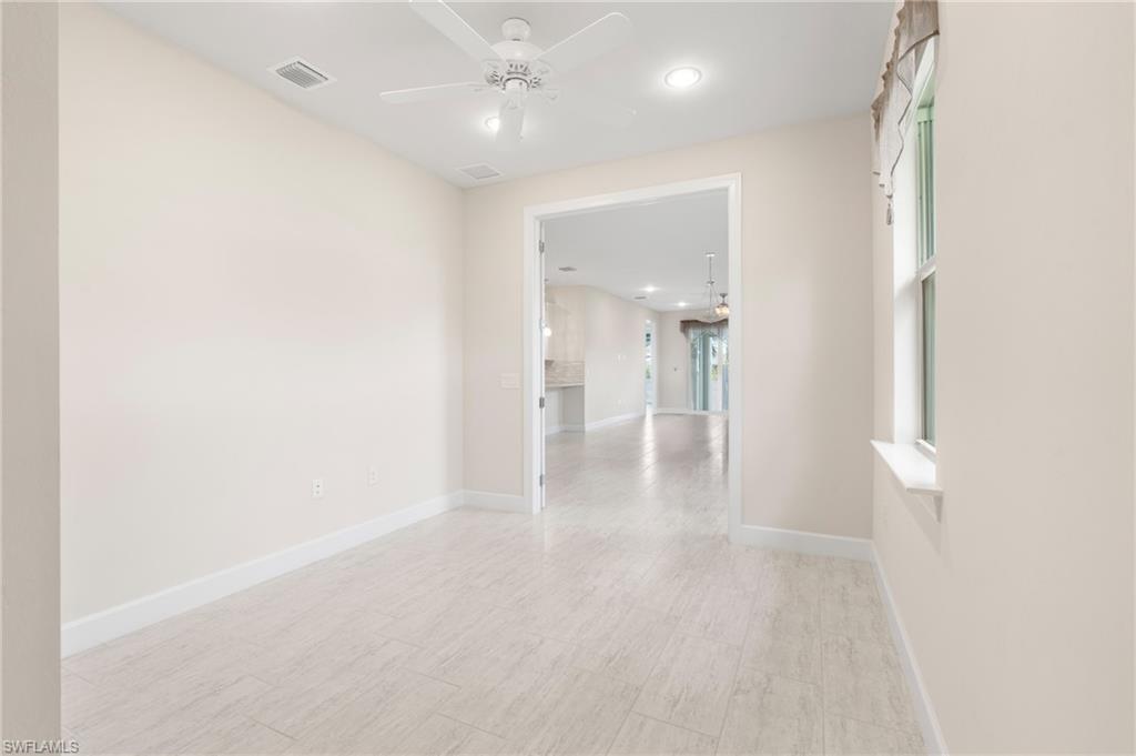 20128 Torch Key Way Estero, FL 33928 - Photo 20 of 50 a view of a hallway with wooden floor